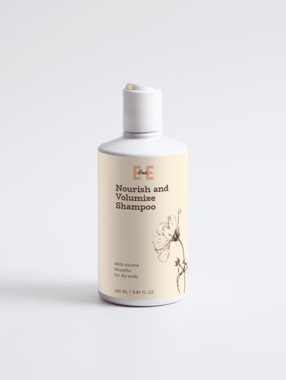 Shampoo bottle labeled 'Nourish and Volumize Shampoo' on a white background