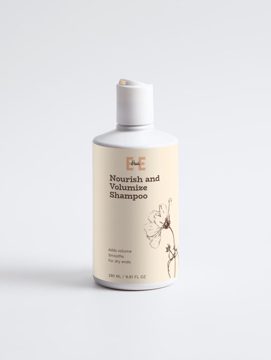 Shampoo bottle labeled 'Nourish and Volumize Shampoo' on a white background