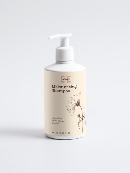Bottle of moisturizing shampoo on a white background