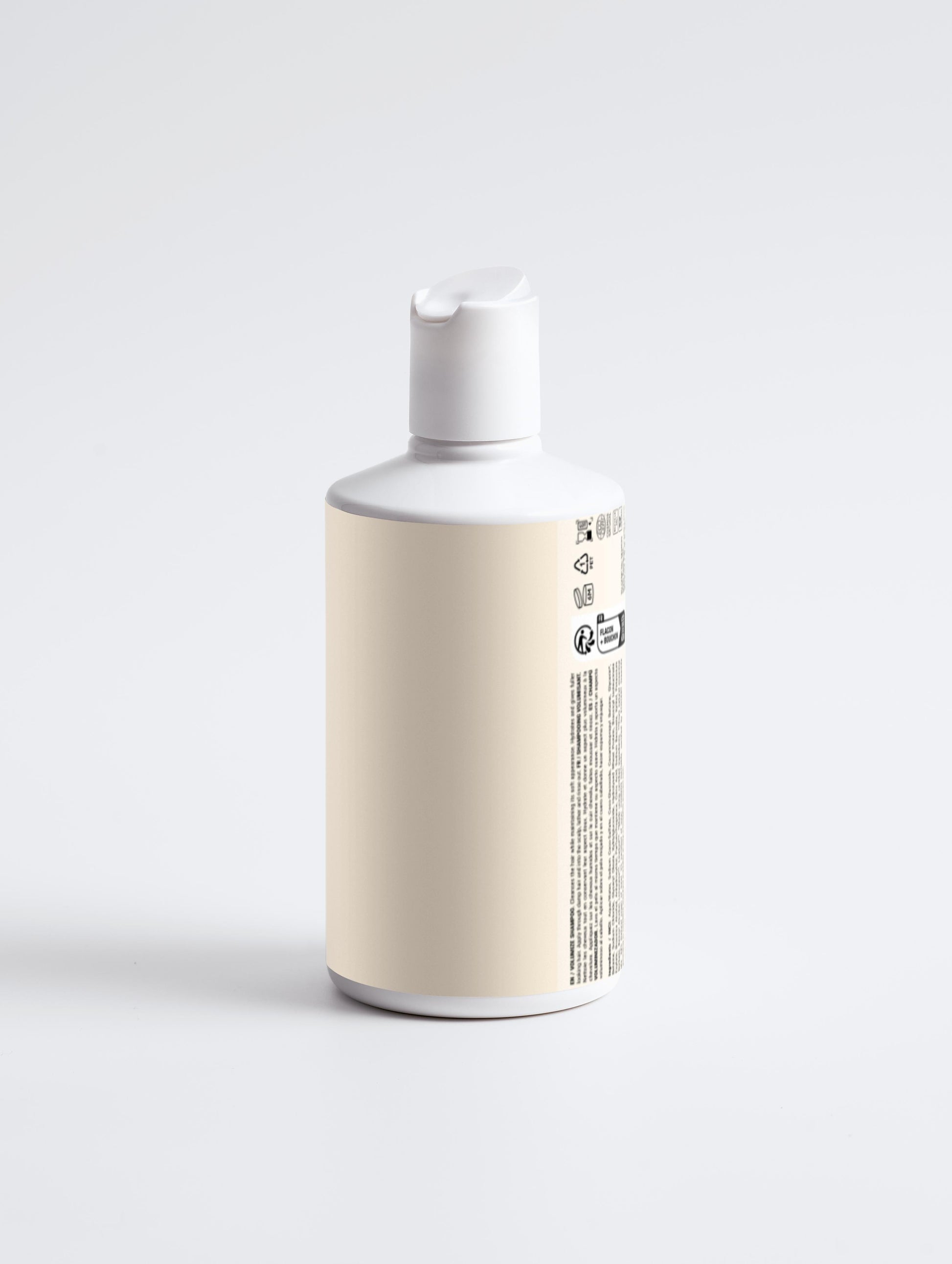 White bottle with a beige label on a light gray background