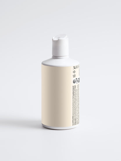 White bottle with a beige label on a light gray background