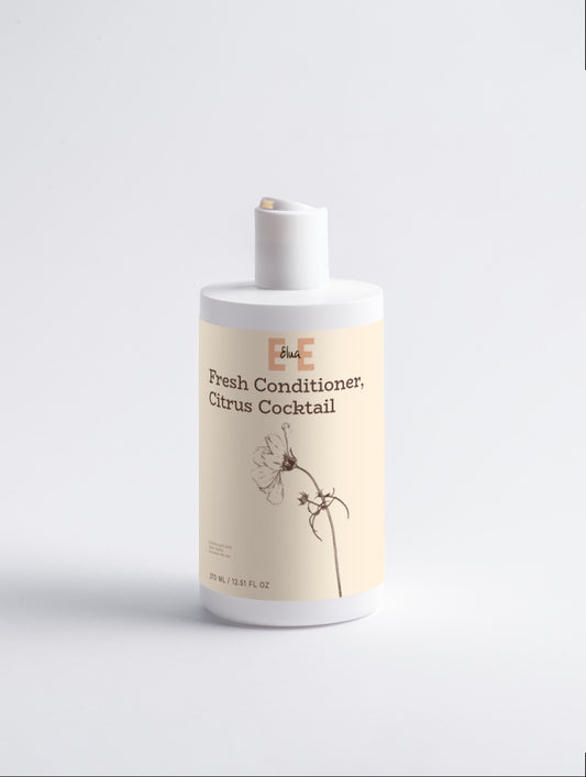 Bottle of 'Fresh Conditioner, Citrus Cocktail' on a light gray background