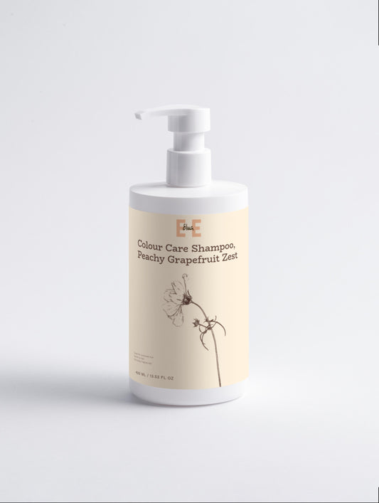 Shampoo bottle with a beige label on a light gray background