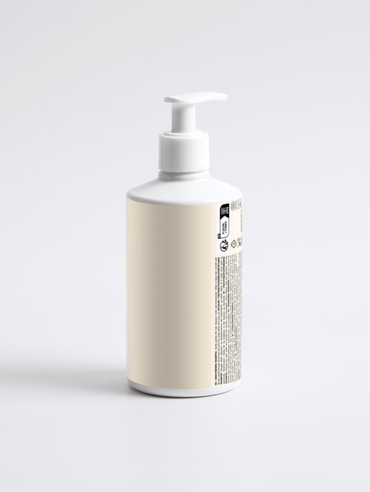 White bottle with a pump on a light gray background